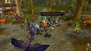 alt="hallow's end has arrived in world of warcraft...unless you're on garona - players fighting the headless horseman in goldshire before the bug"/>